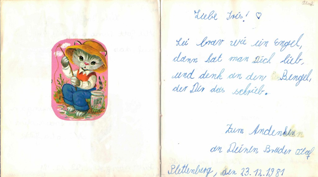 Scan aus meinem Poesiealbum mit dem Eintrag meines Bruders samt Katzen-Glanzbild: "Sei brav wie ein Engel, dann hat man Dich lieb und denk an den Bengel, der Dir das schrieb. Zum Andenken an Deinen Bruder Olaf. Plettenberg, den 23.12.1981"